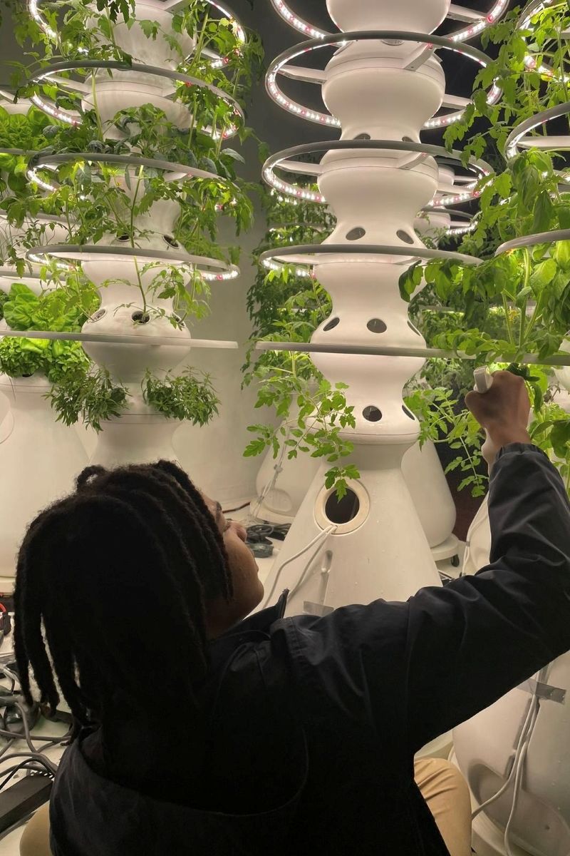 Malon E.D. James checks his hydroponics.jpg